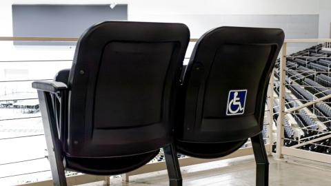 Accessible seats overlooking the stage and digital board.